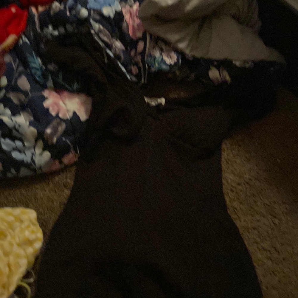 black shirt dress with padding and puffy shoulders